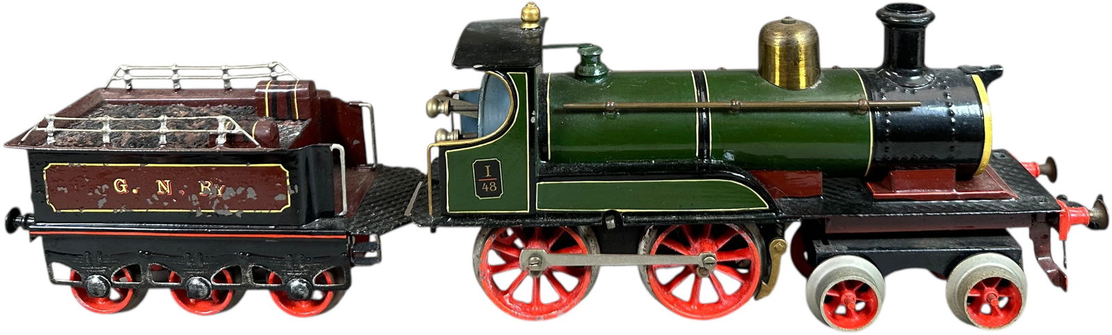 RARE BING ENGLISH OUTLINE LOCOMOTIVE: 359. RARE BING ENGLISH OUTLINE LOCOMOTIVE | Gauge 1, clockwork, hand painted. | 10" l. loco | Professionally restored, tender has some flaking but overall (Excellent Condition) | $700 - $1,000
