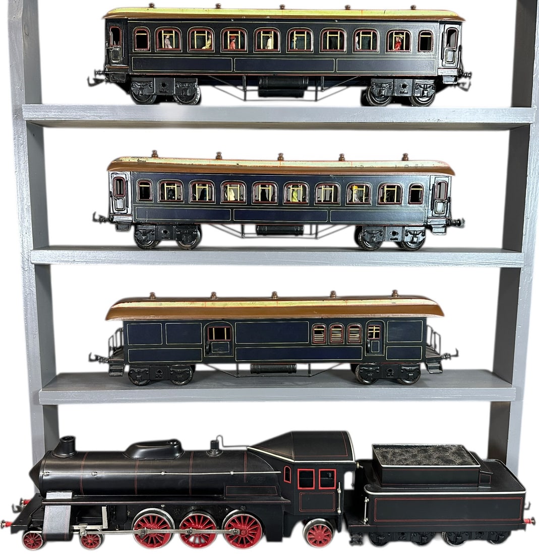 BING GAUGE 1 WINDCUTTER PASSENGER TRAIN SET: 365. BING GAUGE 1 WINDCUTTER PASSENGER TRAIN SET | Gauge 1, clockwork 4-6-2 loco, cars have nice interiors with seated passengers. | Professionally restored and matched set, (Excellent Condition) | $1