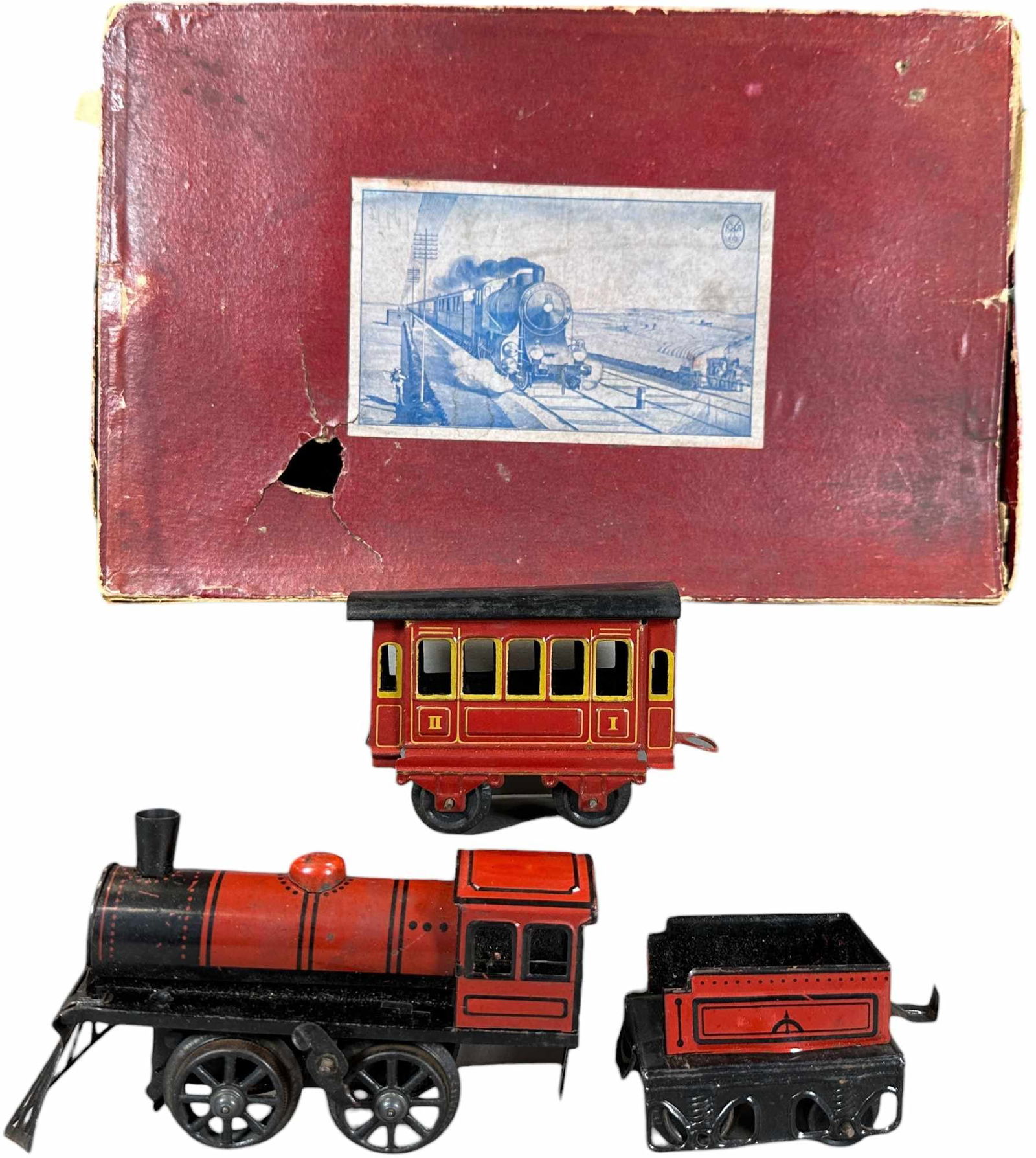 BOXED KARL BUB WINDUP TRAIN SET: 373. BOXED KARL BUB WINDUP TRAIN SET | O gauge, wind-up, litho. | 5.5" l. loco | One tab broken on tender, overall (Excellent Condition) | $250 - $500