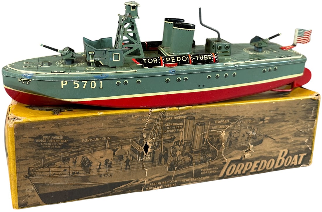 MARUSAN BOXED HAND-CRANKED TORPEDO BOAT: 382. MARUSAN BOXED HAND-CRANKED TORPEDO BOAT | Japan. | 11" l. | Very minor typical factory touch ups at tabs and underside of hull, age related wear and tear to box, (Excellent to Pristine Condition)