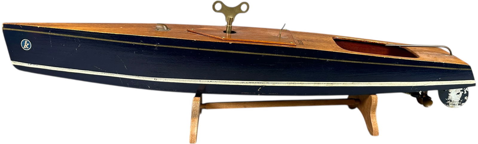 LARGE WOODEN WIND-UP SPEEDBOAT: 390. LARGE WOODEN WIND-UP SPEEDBOAT | 25" l. | Minor repair to bottom of hull where prop shaft protrudes, otherwise working well in (Excellent to Pristine Condition) | $300 - $600
