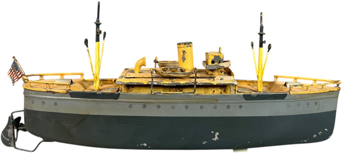 IVES MERCHANT SHIP: 395. IVES MERCHANT SHIP | USA, wind-up driven. | 12.5" l. | Masts are typical replacements, other than some flaking to deck the boat is in (Very Good to Excellent Condition) | $250 - $500