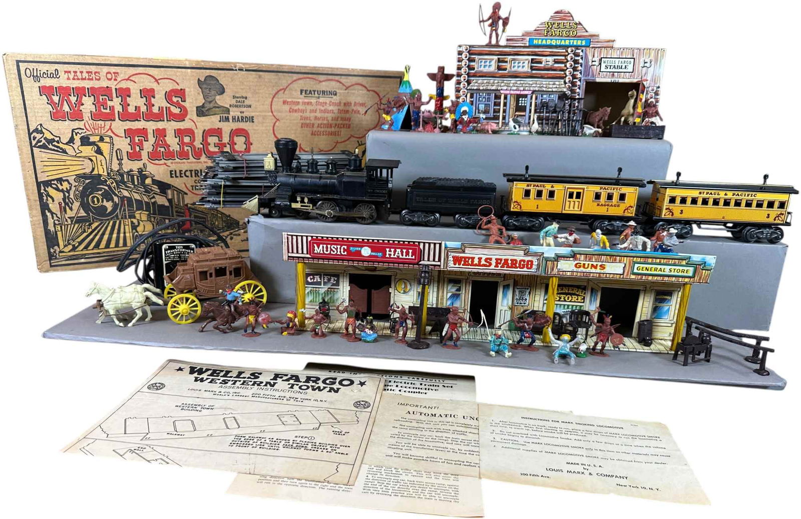 MARX PLAYSET TALES OF WELLS FARGO #54762: 399. MARX PLAYSET TALES OF WELLS FARGO #54762 | Boxed set with Wm. Crooks train set, western accessories, Cowboys and Indians. | Not complete major pieces present, paint enhancement to figures,