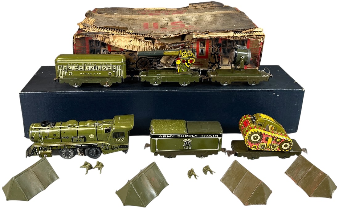 BOXED MARX ARMY TRAIN SET: 400. BOXED MARX ARMY TRAIN SET | O gauge, electric. | 9" l. loco | Includes some figures and partially repainted tents, one car has water damage on one side, complete but distressed box, (Very Good Co