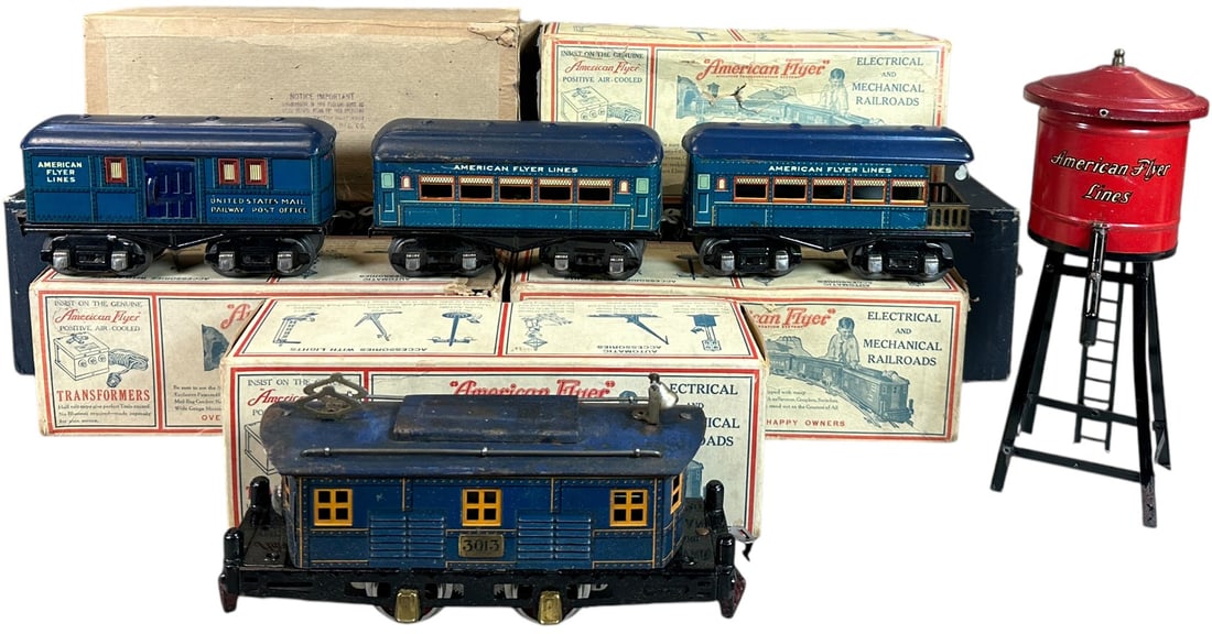 BOXED AMERICAN FLYER NO.3013 TRAIN SET: 408. BOXED AMERICAN FLYER NO.3013 TRAIN SET | O gauge, electric, includes water tower. | 8.5" l. loco | Expected wear and tear to carboard boxes, wear to loco roof (Very Good Condition), cars in overa