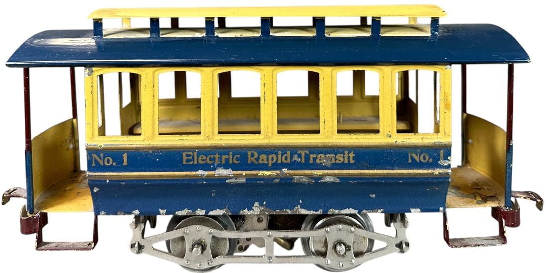 LIONEL SIX WINDOW NO.1 TROLLEY: 411. LIONEL SIX WINDOW NO.1 TROLLEY | Standard gauge, embossed windows, blue lower body paint. Provenance: Bradley Kaplan Collection. | 10.5" l. | Authentic roof has repaint, body is original with