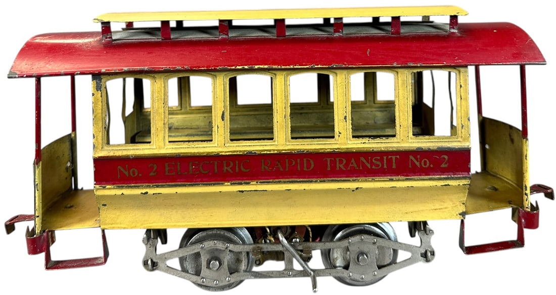 LIONEL NO.2 TROLLEY: 412. LIONEL NO.2 TROLLEY | Standard gauge, embossed windows. | 10.5" l. | One end ramp wall is glued to posts, paint is nice and all original, (Excellent Condition) | $800 - $1,600