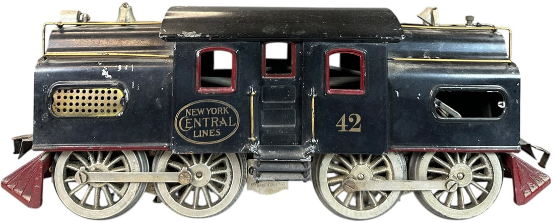 LIONEL DUAL MOTOR NO.42 LOCOMOTIVE: 415. LIONEL DUAL MOTOR NO.42 LOCOMOTIVE | Standard gauge, electric. | 13" l. | Missing one gold screen, typical playwear in overall (Very Good to Excellent Condition) | $400 - $800
