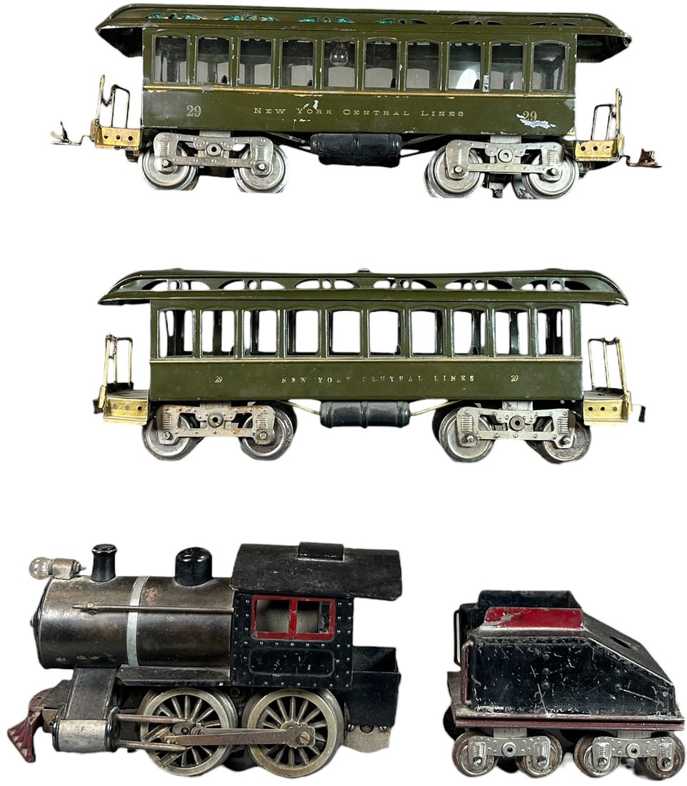 LIONEL NO.5 LOCO W/ DAY COACHES: 416. LIONEL NO.5 LOCO W/ DAY COACHES | Standard gauge, electric. | 9.5" l. loco | Tender is original, outside of loco and cars is an old professional restoration which does not reflect poorly under bl