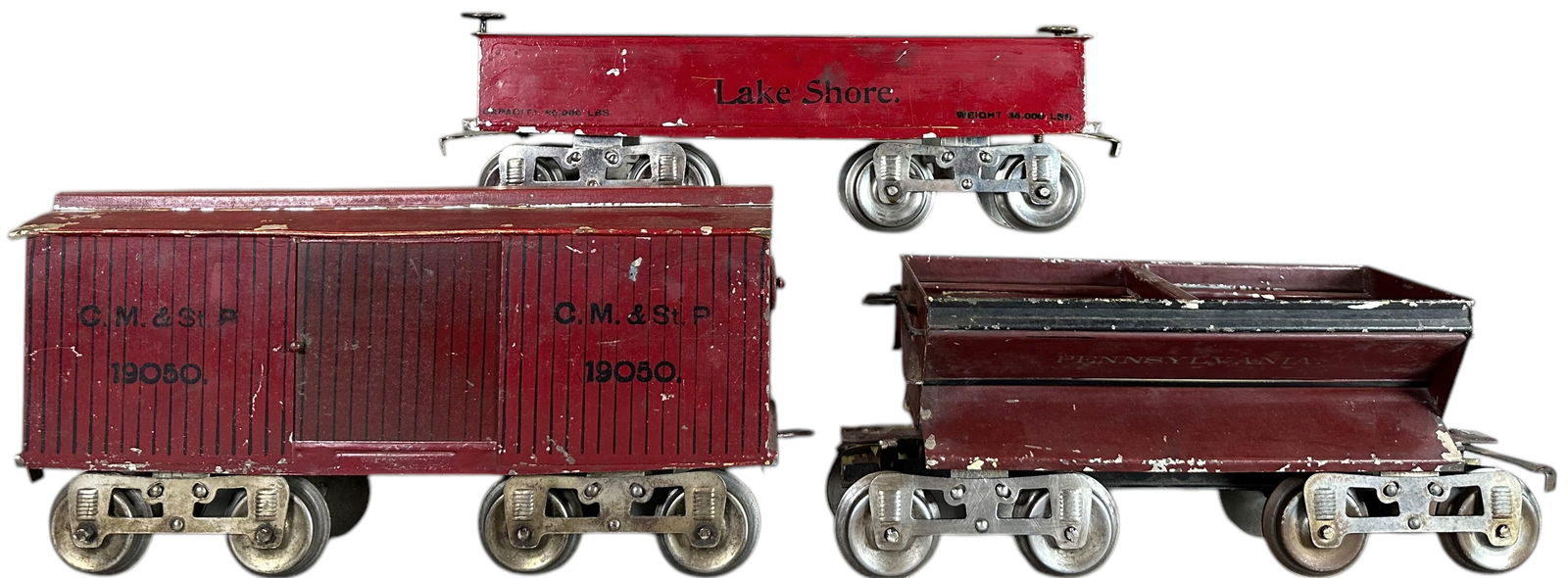 LIONEL YELLOW PRIMER 10 SERIES CARS: 417. LIONEL YELLOW PRIMER 10 SERIES CARS | Standard gauge, early three rivet trucks, yellow primer. Provenance: Bradley Kaplan Collection. | One sliding door is authentic but added from another car, o