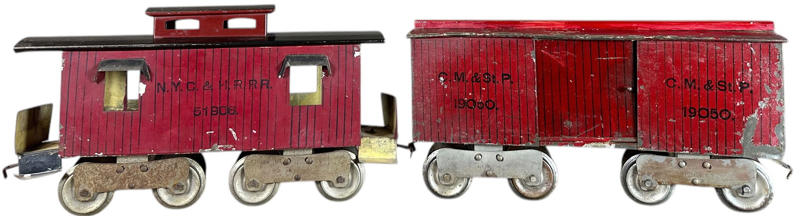 EARLY LIONEL SOLID FRAME 10 SERIES CARS: 425. EARLY LIONEL SOLID FRAME 10 SERIES CARS | Standard gauge, early solid frame trucks, yellow primer. Provenance: Bradley Kaplan Collection. | Center piece of box car roof replaced and held in place