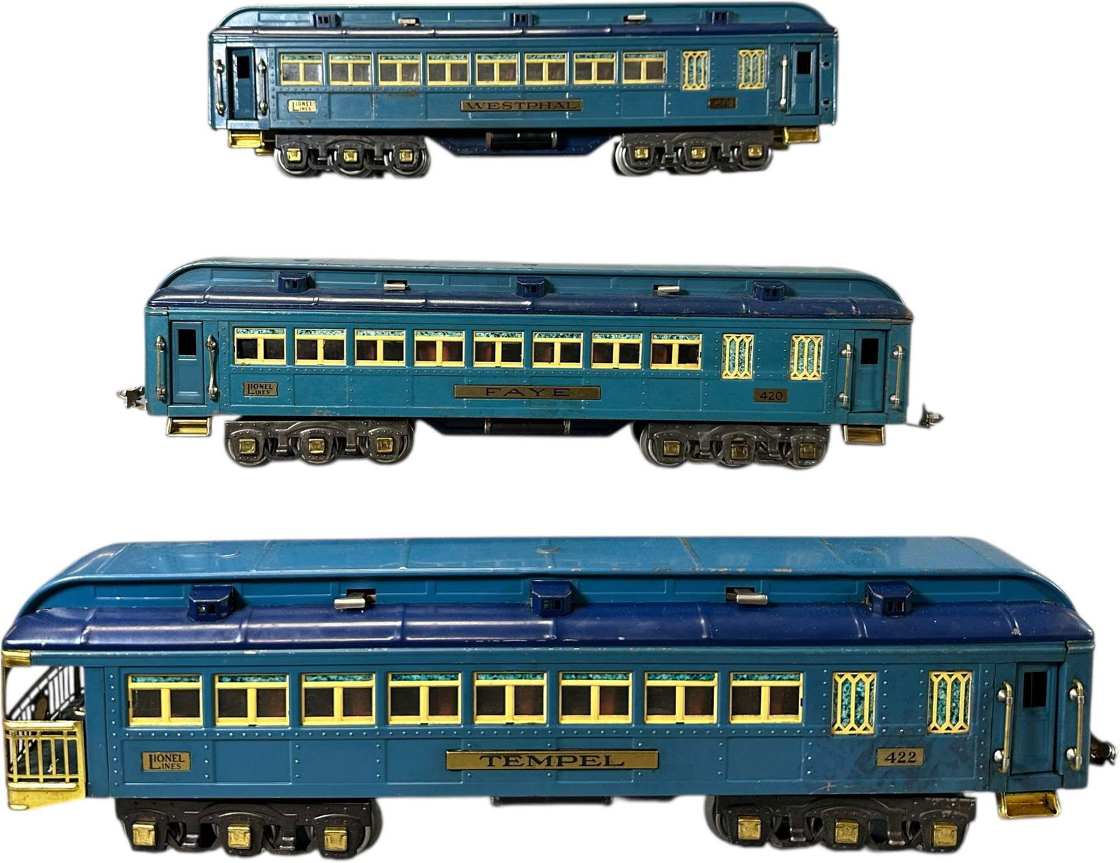 THREE LIONEL BLUE COMET PASSENGER CARS: 439. THREE LIONEL BLUE COMET PASSENGER CARS | Standard Gauge. | 18" l. | Two couplers missing, two handrails missing, Temple car has professionally restored roof, overall (Excellent Condition) | $800