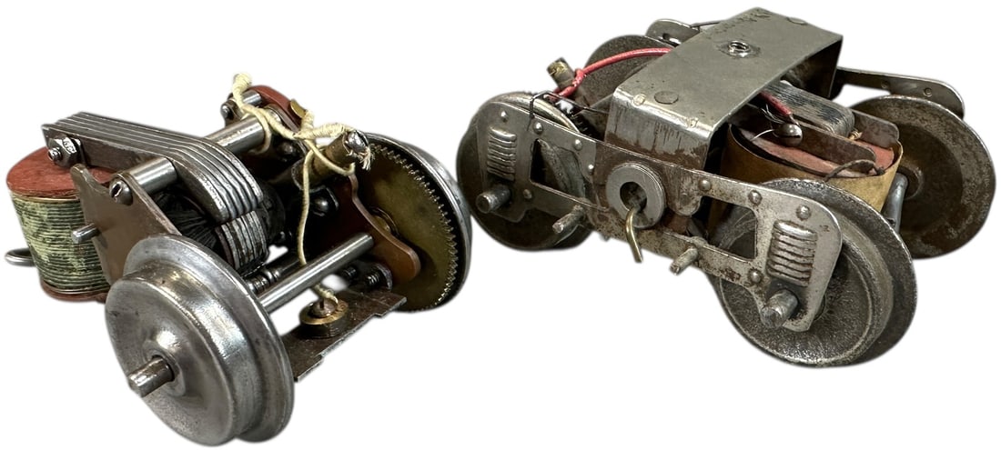 TWO EARLY LIONEL TROLLEY MOTORS: 444. TWO EARLY LIONEL TROLLEY MOTORS | One is an early brass plate motor. Provenance: Bradley Kaplan Collection. | 4" l. | (Excellent Condition) | $400 - $800