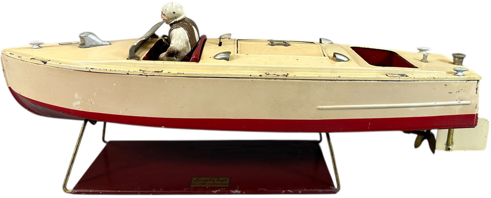 LIONEL #43 SPEEDBOAT: 451. LIONEL #43 SPEEDBOAT | 18" l. | Original figures are well preserved, with authentic cradle, overall (Excellent Condition) | $400 - $700