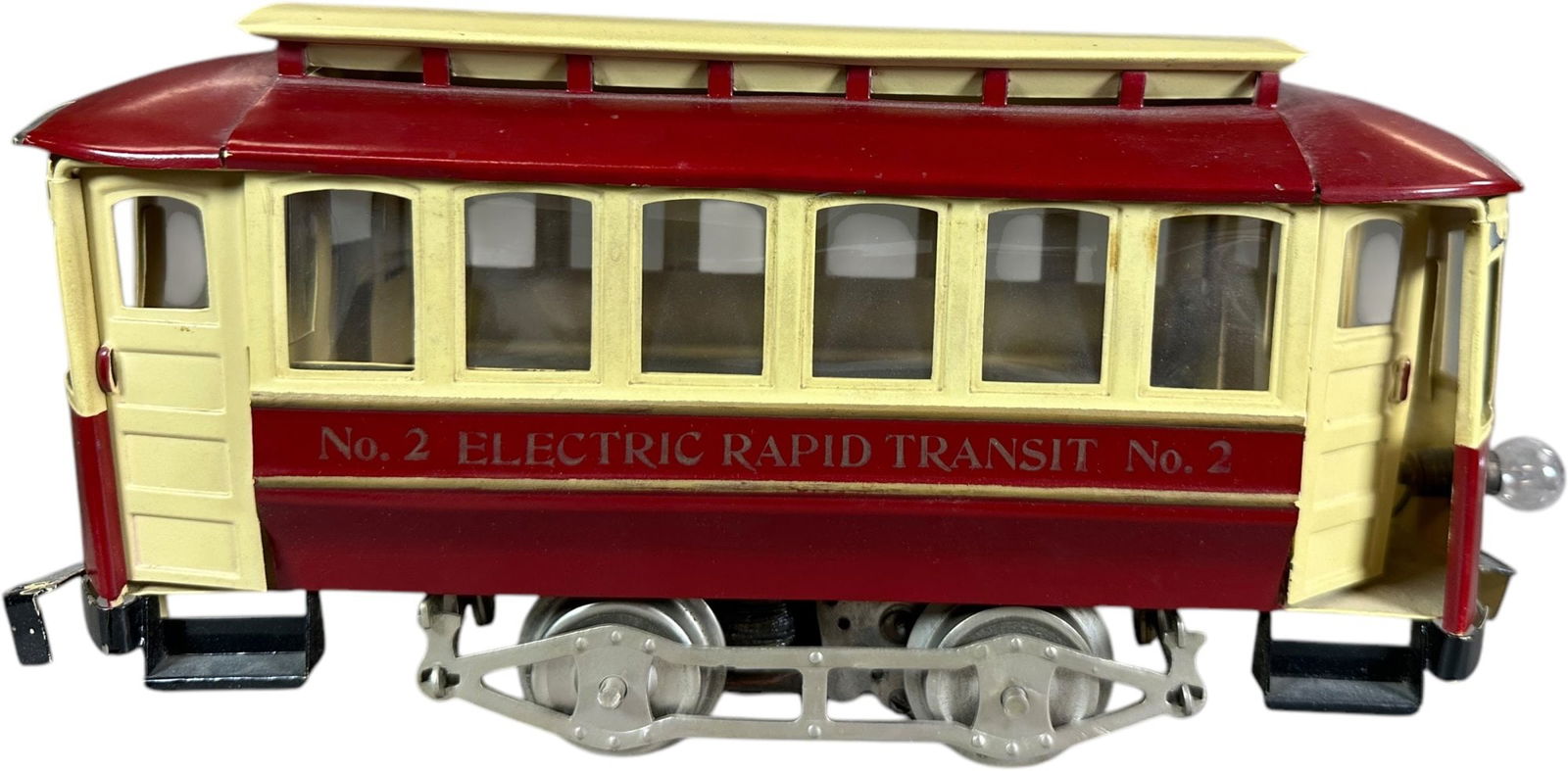 LIONEL NO.2 CLOSED VESTIBULE TROLLEY: 464. LIONEL NO.2 CLOSED VESTIBULE TROLLEY | Standard gauge, electric. | 11.5" l. | Older restoration, displays in (Excellent Condition) | $600 - $1,000