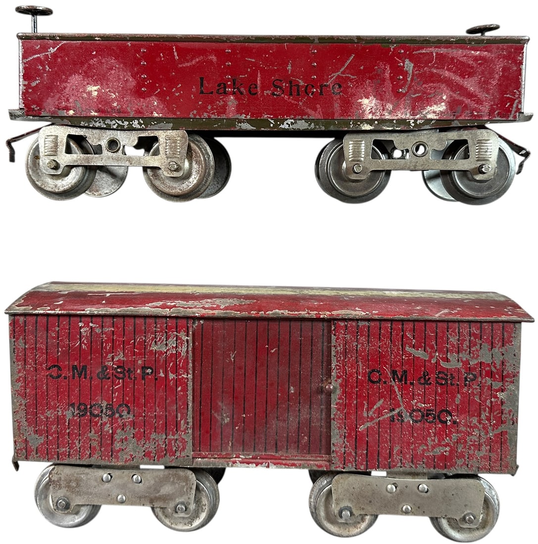 EARLY LIONEL HOLLOW RIVET & YELLOW PRIMER CARS: 469. EARLY LIONEL HOLLOW RIVET & YELLOW PRIMER CARS | Standard gauge, yellow primer box car with hollow rivet gondola. Provenance: Bradley Kaplan Collection. | 11.5" l. | Box car is missing clerestory