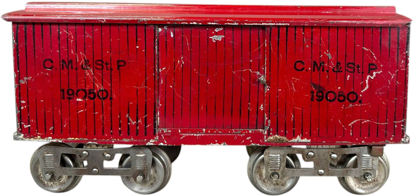 EARLY LIONEL YELLOW PRIMER NO.14 BOX CAR: 470. EARLY LIONEL YELLOW PRIMER NO.14 BOX CAR | Standard gauge, early yellow primer car with 3-rivet trucks, flat sides and one piece roof. | 11" l. loco | One coupler missing, overall (Excellent Cond