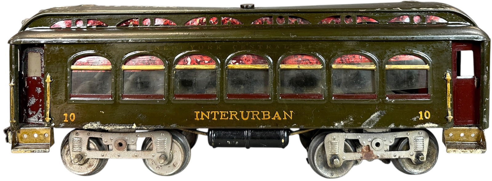 LIONEL INTERURBAN TROLLEY: 476. LIONEL INTERURBAN TROLLEY | Standard gauge, electric. | 15.5" l. | Original paint has been lacquered throughout, appears to be a passenger car with Interurban lettering added, (Very Good Conditio