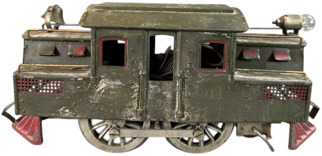 LIONEL SQUARE CAB 1911 LOCOMOTIVE: 477. LIONEL SQUARE CAB 1911 LOCOMOTIVE | Standard gauge. Provenance: Bradley Kaplan Collection. | 9.5" l. | (Very Good Condition) | $350 - $700