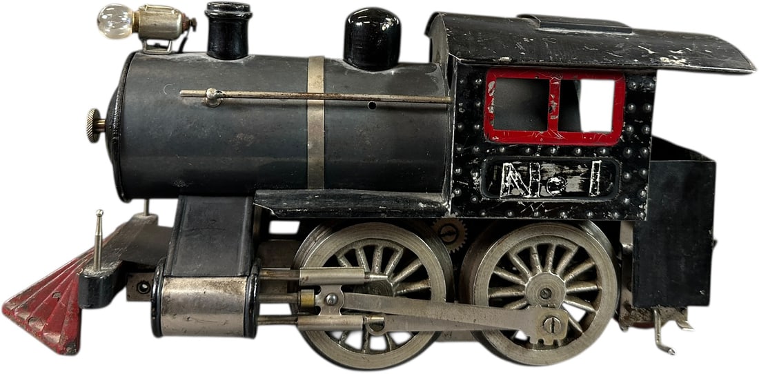 RARE LIONEL NO.5 PENNSYLVANIA LOCO: 484. RARE LIONEL NO.5 PENNSYLVANIA LOCO | Standard gauge, has rare Pennsylvania lettering. Provenance: Bradley Kaplan Collection. | 11" l. loco | Lettering worn off on one side, some repainting to coa