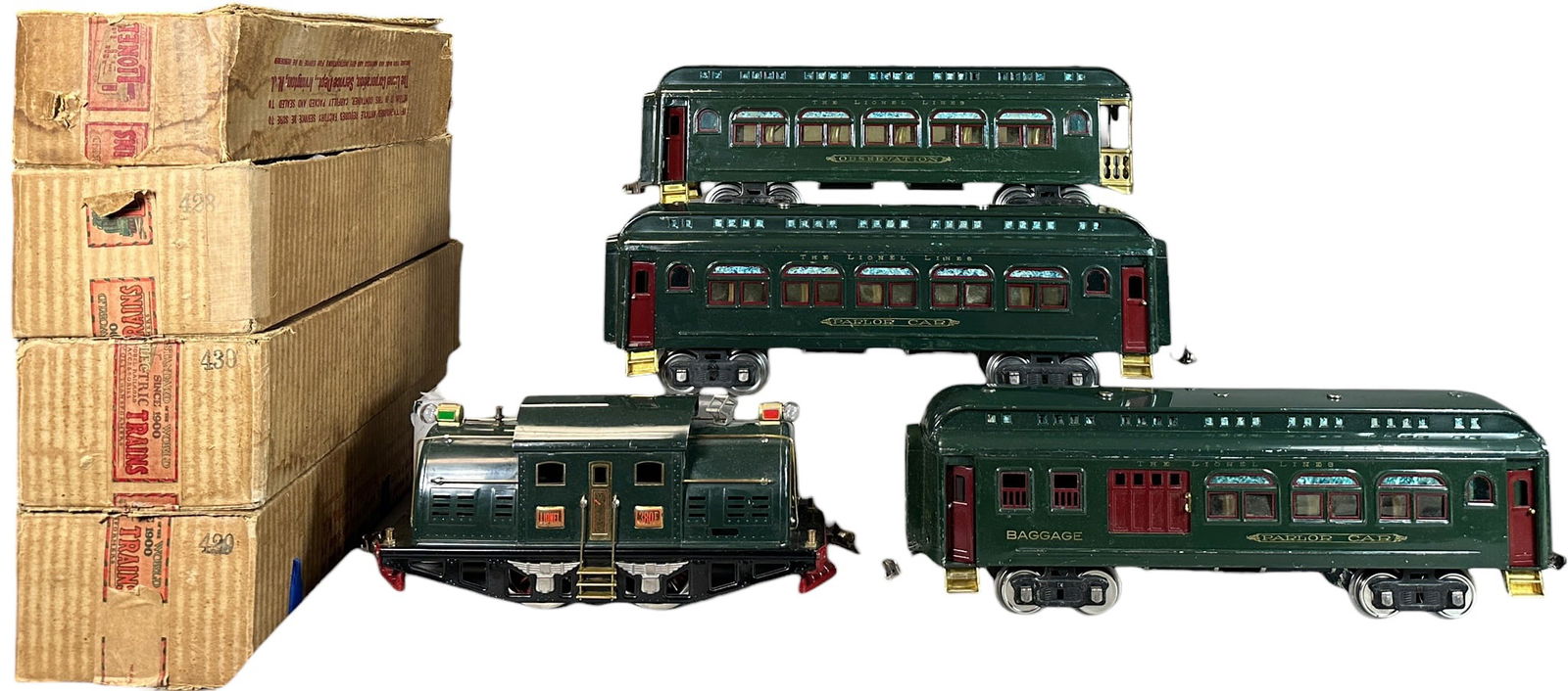 LIONEL 380E SET W/ BOXES: 497. LIONEL 380E SET W/ BOXES | Standard gauge. | 12.5" l. loco | Drive wheels replaced, touch-up to loco frame, touch-up to knicks and small scratches throughout cars, displays in (Very Good to Excel