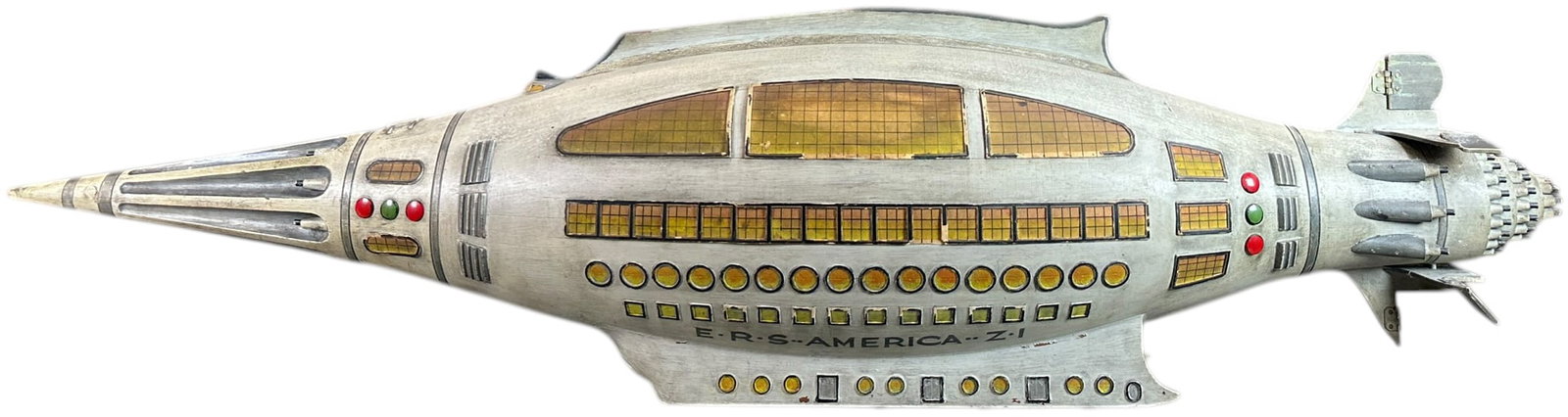 PRE-WAR JAPANESE SPACESHIP/SUBMARINE: 27. PRE-WAR JAPANESE SPACESHIP/SUBMARINE | 36" l. | A few minor bits and pieces chipped, top fin chipped on front edge, overall a very cool piece in (Excellent Condition) | $800 - $1,400