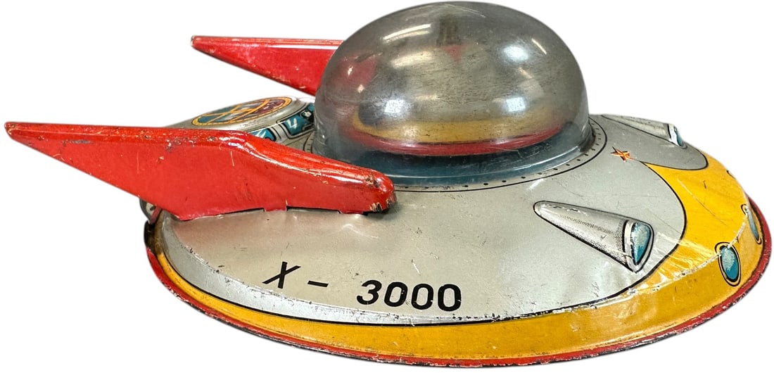 MASUDAYA FLYING SAUCER X-3000: 1023. MASUDAYA FLYING SAUCER X-3000 | Japan, friction driven | 7.5" l. | Minor pressure splits to plastic windshield, working friction and rotation, minor factory touch-up at tailfins, (Very Good to