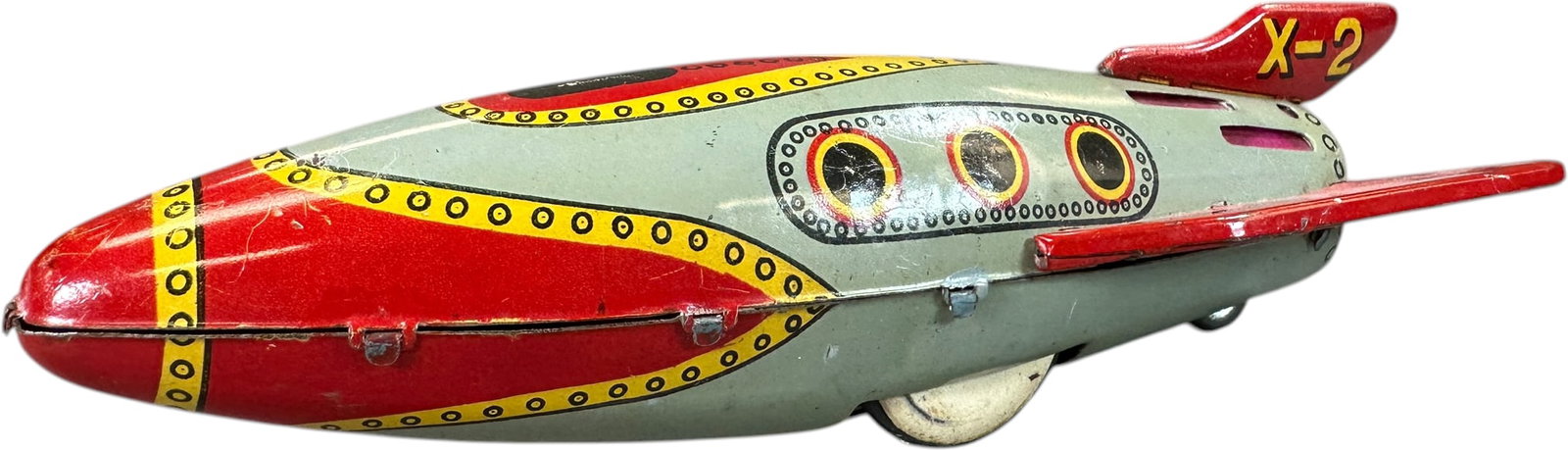 MASUDAYA X-2 ROCKET: 1032. MASUDAYA X-2 ROCKET | Japan, friction driven. | 8" l. | Friction works but needs a flint for sparks, (Very Good to Excellent Condition) | $100 - $200
