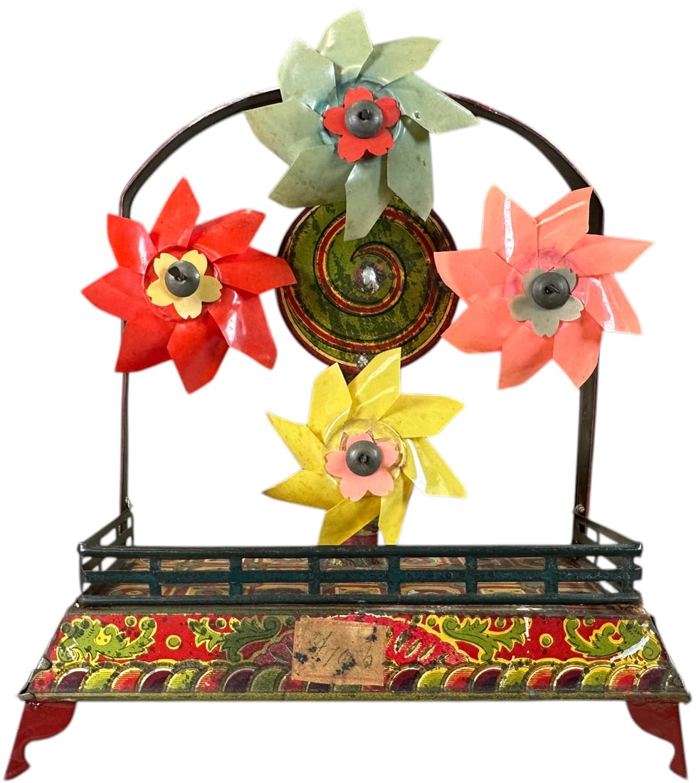 JAPANESE REVOLVING PINWHEEL TOY: 1067. JAPANESE REVOLVING PINWHEEL TOY | Japan, wind-up driven, activation causes the four pinwheels to revolve, allowing them to spin in a fun visual array of color! Provenance: Bill Gallagher Collect