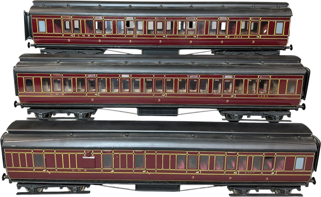 THREE WELL MADE LMS 1ST CLASS PASSENGER CARS: 1283. THREE WELL MADE LMS 1ST CLASS PASSENGER CARS | Gauge 1, brass construction. Provenance: The Maloy Collection. | 24" l. | Two windows damaged, one thin trim piece missing from one car roof, other