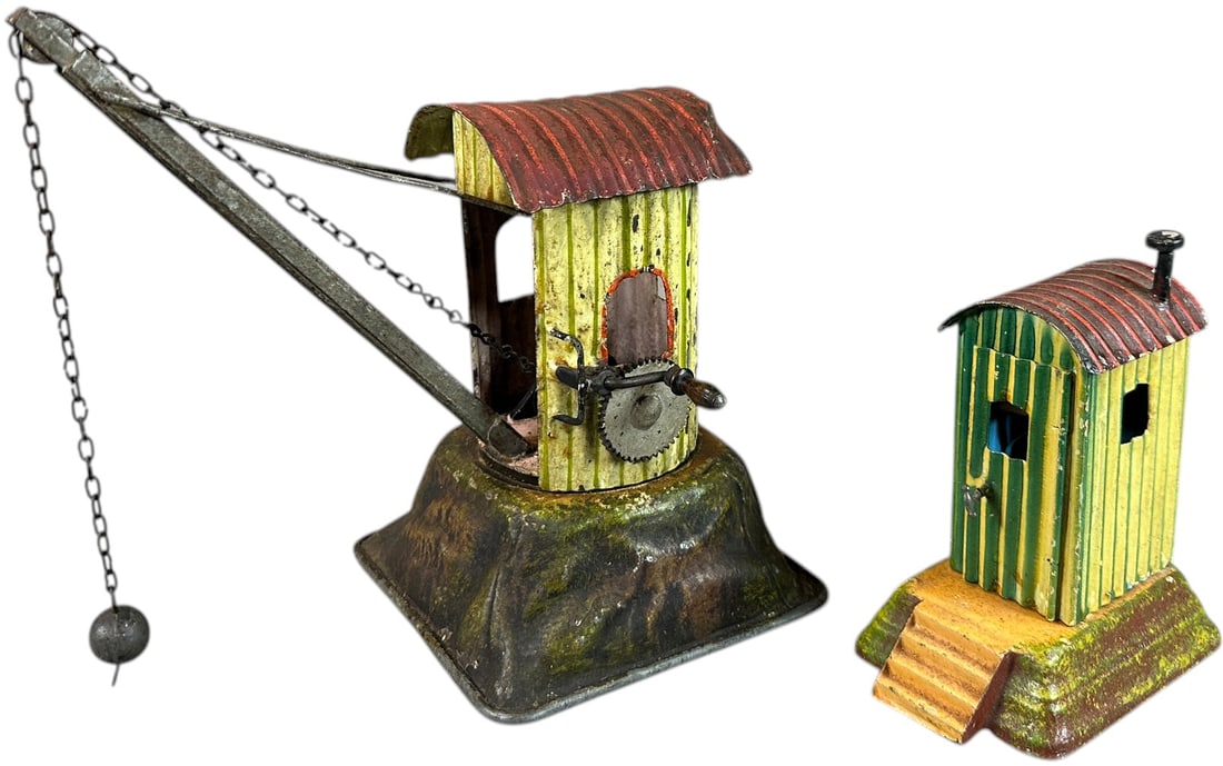 MARKLIN CRANE & GUARD SHACK: 1291. MARKLIN CRANE & GUARD SHACK | Germany, hand painted, crane has embossed base with detailed painting to simulate hillside, guard shack lifts off base to reveal small chair and bed for resting rai