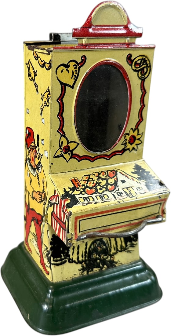 GERMAN OVAL WINDOW VENDING BANK: 1346. GERMAN OVAL WINDOW VENDING BANK | Nice lithograph covers this bank, the pretzel tree. Provenance: The Maloy Collection. | 6.5" h. | (Excellent Condition) | $200 - $300