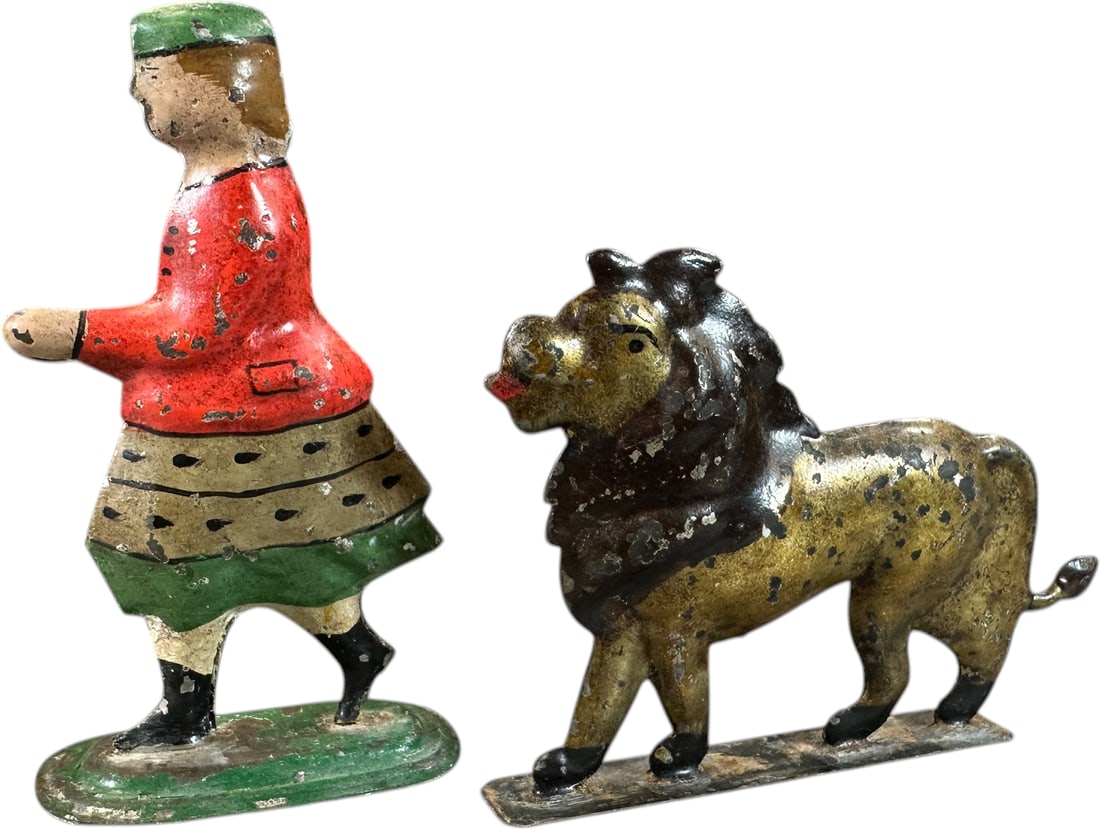 GEORGE BROWN GIRL & LION: 1423. GEORGE BROWN GIRL & LION | Provenance: The Maloy Collection. | 3.5" l. | Professionally restored with great paint, (Excellent Condition) | $300 - $600