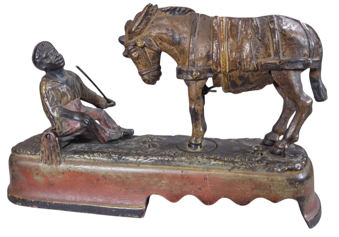 SPISE A MULE MECHANICAL BANK: 1437. SPISE A MULE MECHANICAL BANK | J&E Stevens Co. | CULTURAL DISCLAIMER: Certain antique and vintage items in this sale include imagery or themes that reflect racial stereotypes now recognized as