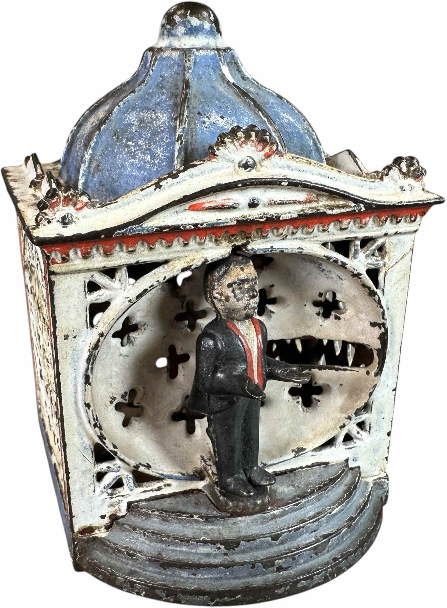 HALLS LILLIPUT MECHANICAL BANK: 1445. HALLS LILLIPUT MECHANICAL BANK | J&E Stevens Co. | 4" h. | Original figure is missing tray and has some overpaint, very minor enhancement to red roof edging, (Very Good Condition) | $200 - $400