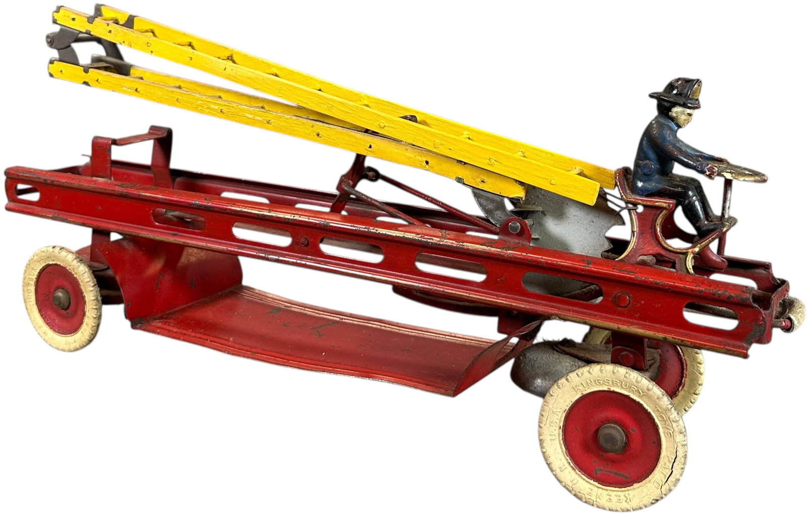 KINGSBURY AERIAL LADDER TRUCK: 1486. KINGSBURY AERIAL LADDER TRUCK | USA, wind-up motor driven. | 18.5" l. | Authentic ladders have yellow overpaint, original rubber tires, (Excellent Condition) | $300 - $400