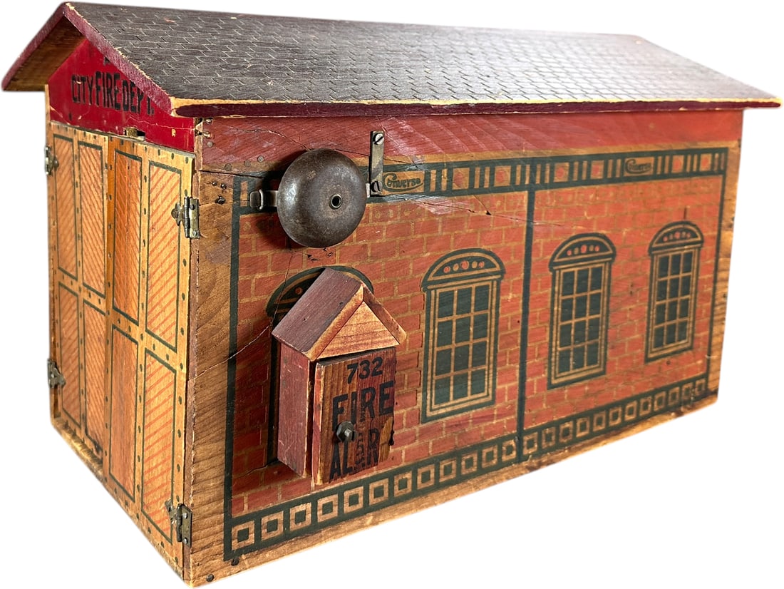 LARGE CONVERSE FIRE HOUSE: 1504. LARGE CONVERSE FIRE HOUSE | USA, wind-up siren. | 20" l. | Working bell, splits to wood expertly reinforced with glue, 1" portion of one door is masterfully repaired, (Excellent Condition) consi
