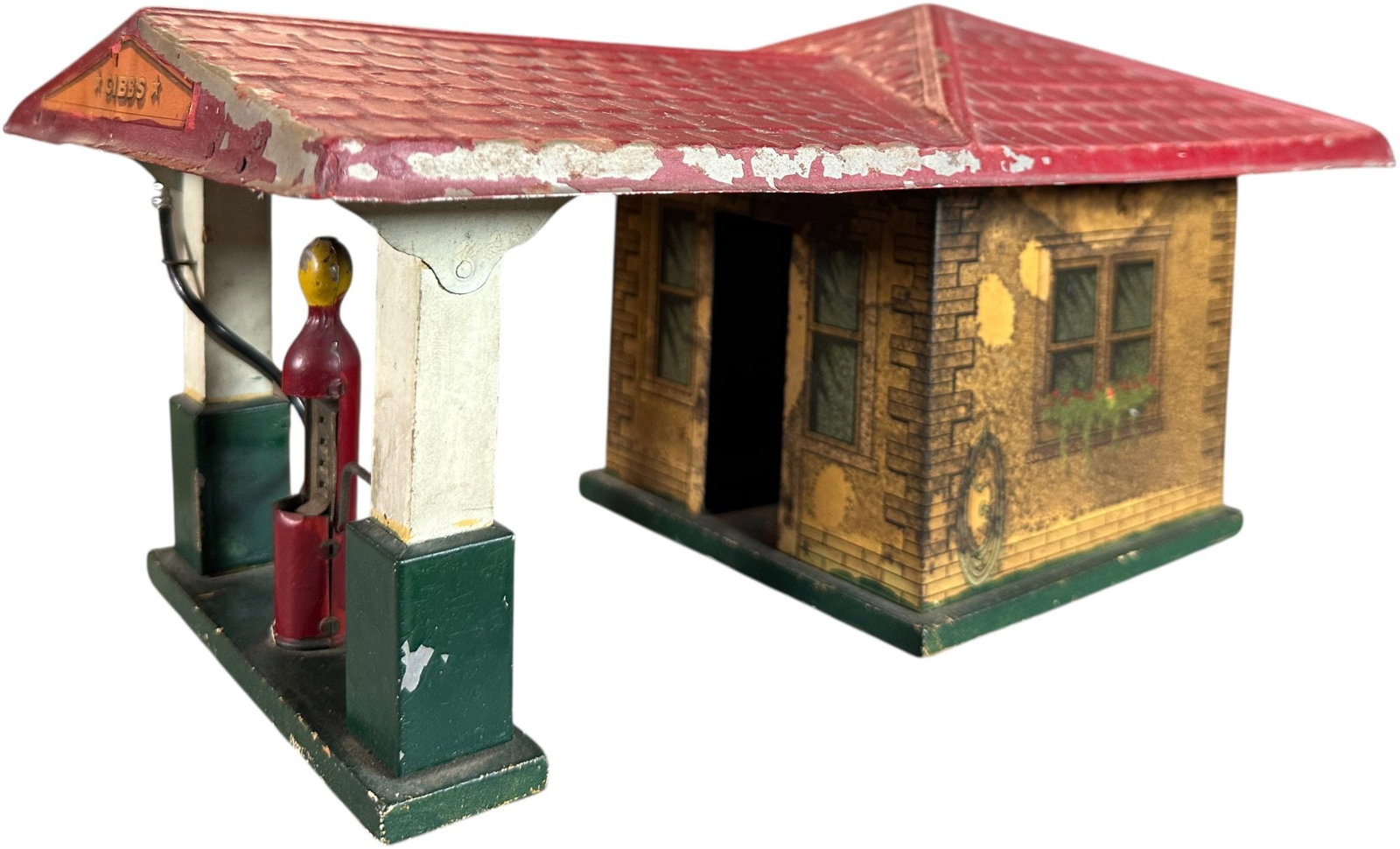 GIBBS SERVICE STATION: 1554. GIBBS SERVICE STATION | 15" l. | Minor denting to edge of roof, above average (Excellent Condition) for this toy. | $150 - $300