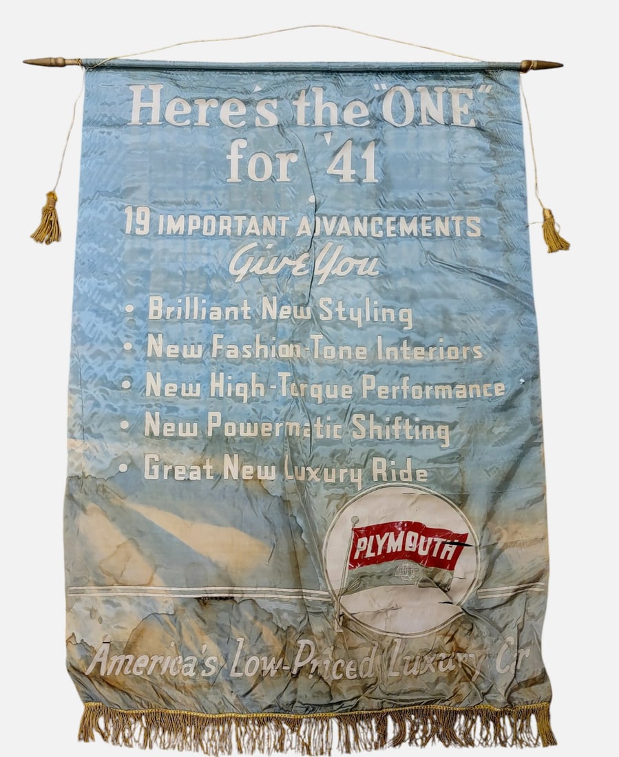 1941 PLYMOUTH DEALERSHIP BANNER: 96. 1941 PLYMOUTH DEALERSHIP BANNER | Circa 1941 silk Plymouth dealership banner promoting the new model year with the slogan, "Here's the 'ONE' for '41," complete with original fringe and wood hangin