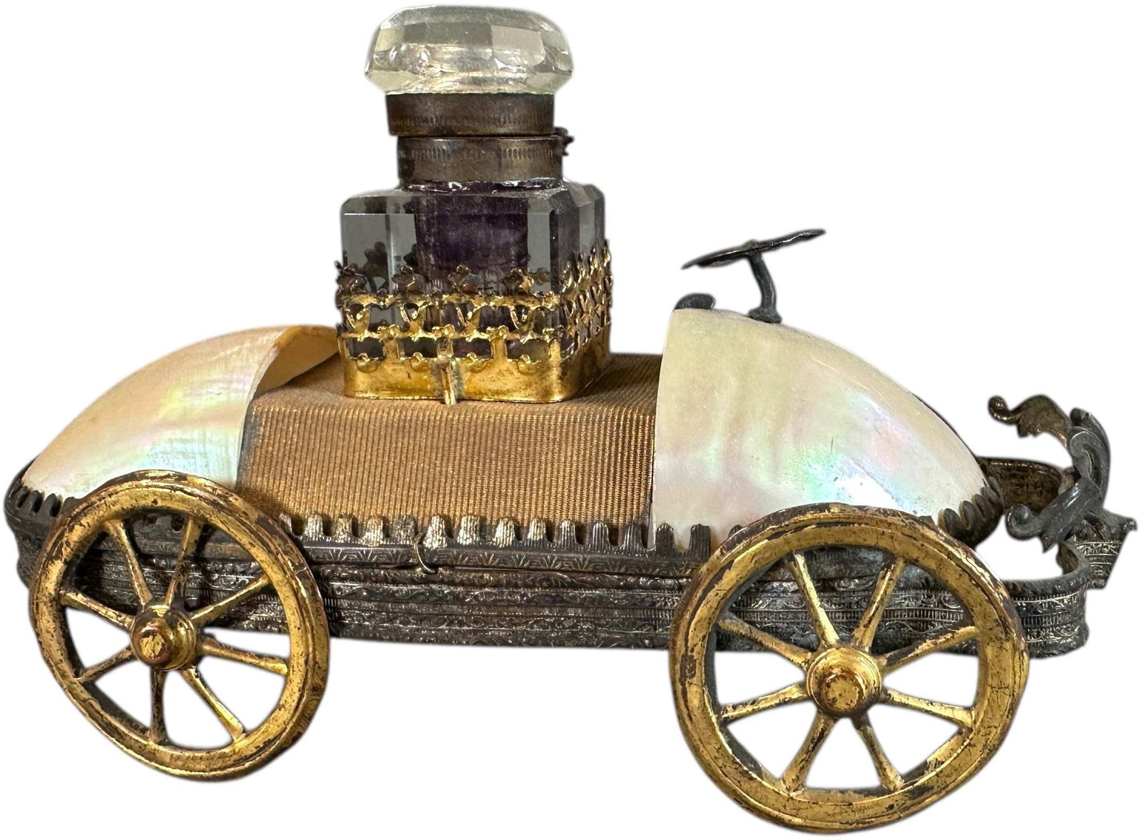 MOTHER OF PEARL AUTOMOBILE INKWELL: 137. MOTHER OF PEARL AUTOMOBILE INKWELL | Detailed design and exceptional craftsmanship. From the David Bausch Automobilia Collection. | 5.5 " l. | (Excellent Condition) | $400 - $600