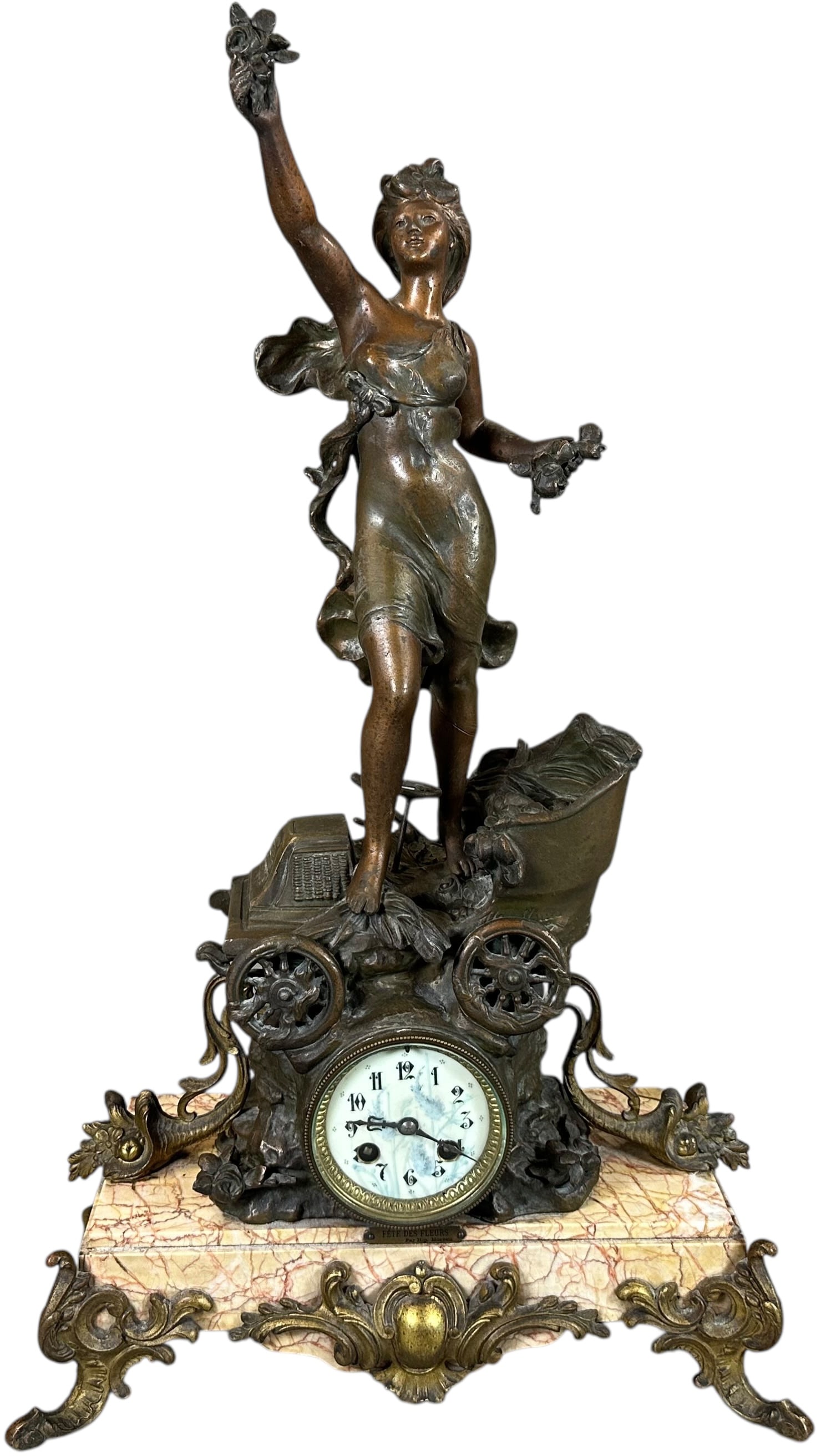 FRENCH FETE DES FLEURS AUTOMOBILE MANTEL CLOCK: 181. FRENCH FETE DES FLEURS AUTOMOBILE MANTEL CLOCK | France, circa 1900?1910, figural mantel clock titled "F?te des Fleurs," featuring an allegorical female figure standing upon an early automobile e