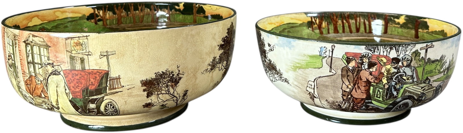 TWO ROYAL DOULTON MOTORING SERIES BOWLS: 198. TWO ROYAL DOULTON MOTORING SERIES BOWLS | Two bowls: small includes 'Room for One' and 'Deaf' pattern; large includes 'Blood Money' and 'Untitled-commonly known as Yokel and motorist outside Cheq