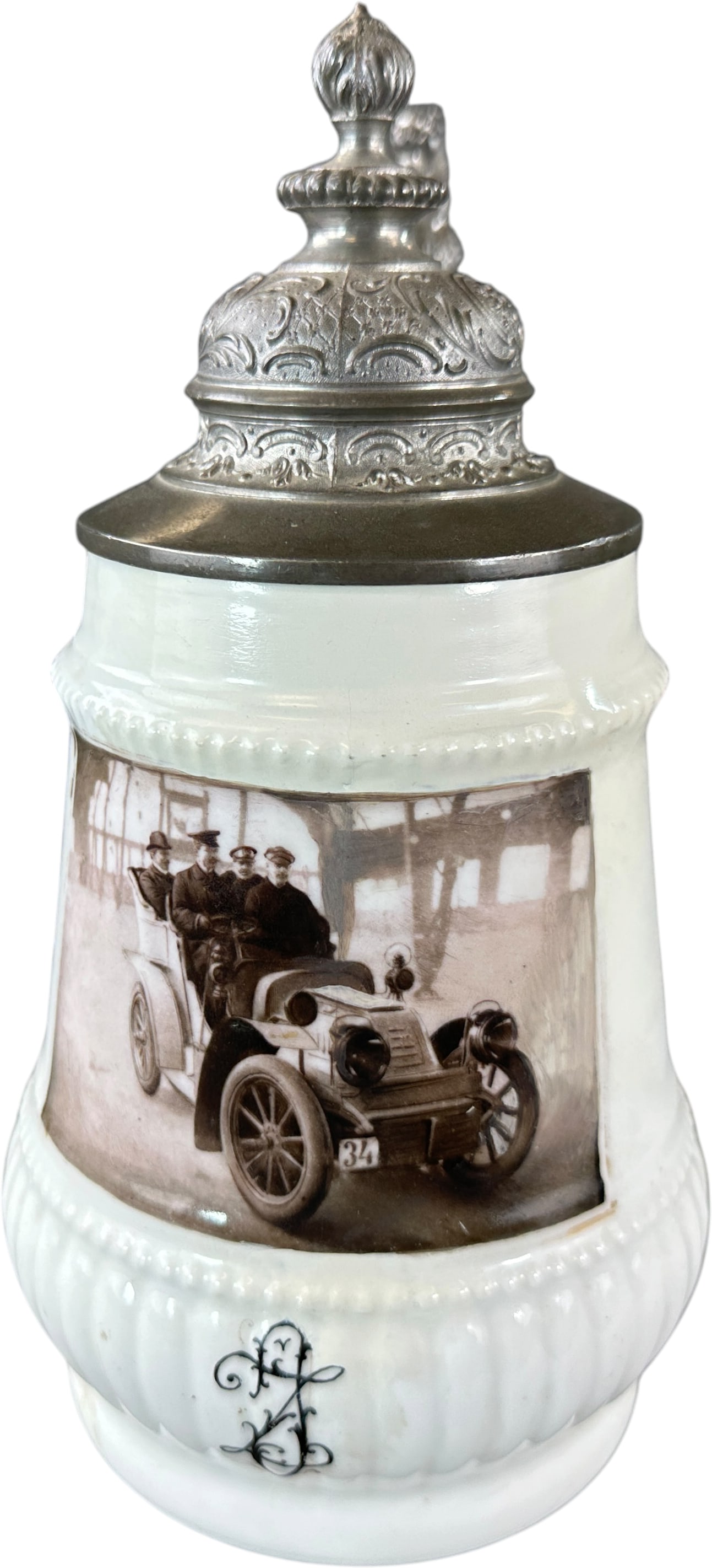 MILK GLASS PHOTOGRAPHIC AUTOMOBILE BEER STEIN: 203. MILK GLASS PHOTOGRAPHIC AUTOMOBILE BEER STEIN | Germany, circa 1905?1915. Milk glass beer stein with pewter-mounted lid featuring a photographic transfer of an early touring automobile and its oc