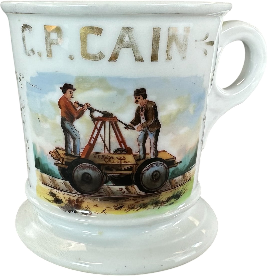 RR HAND CAR OCCUPATIONAL SHAVING MUG: 219. RR HAND CAR OCCUPATIONAL SHAVING MUG | "Weischel" of Texas stamp on base. | 4" h. | Chip repair to base, hairline crack at handle, (Very Good to Excellent Condition) | $100 - $200