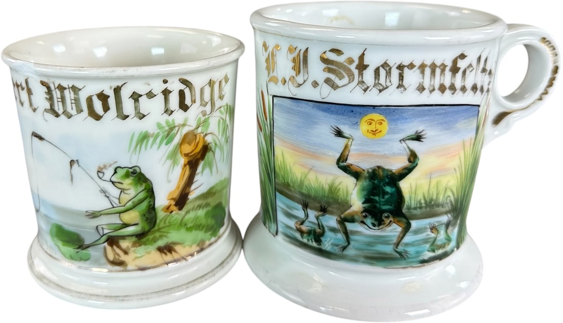 FROG THEME OCCUPATIONAL SHAVING MUGS: 234. FROG THEME OCCUPATIONAL SHAVING MUGS | Occupational shaving mugs were personalized for regular patrons and kept at the barber shop for repeated use. Hand-painted scenes identifying the owner's