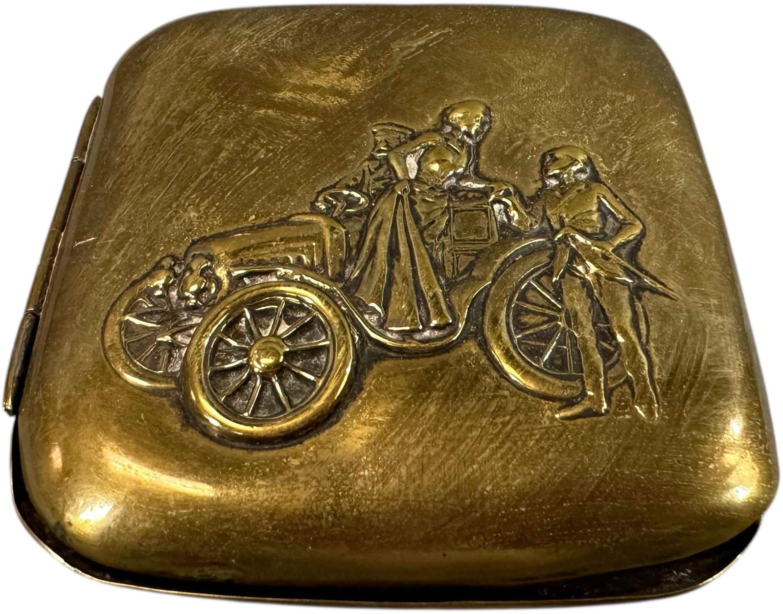 EMBOSSED AUTOMOTIVE CIGARETTE CASE: 240. EMBOSSED AUTOMOTIVE CIGARETTE CASE | Brass. From the David Bausch Automobilia Collection. | 3.5" l. | Latch missing, (Very Good to Excellent Condition) | $300 - $600