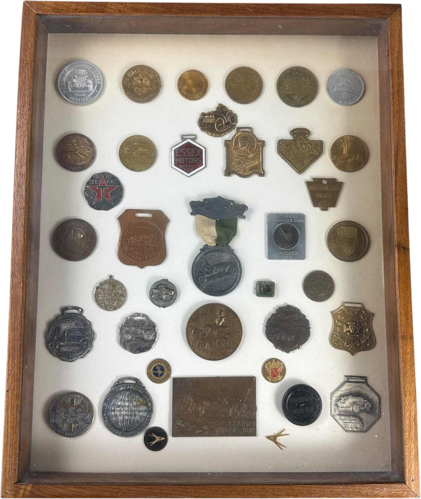 FRAMED COLLECTION OF AUTOMOTIVE BADGES AND MEDALS (1 of 3)