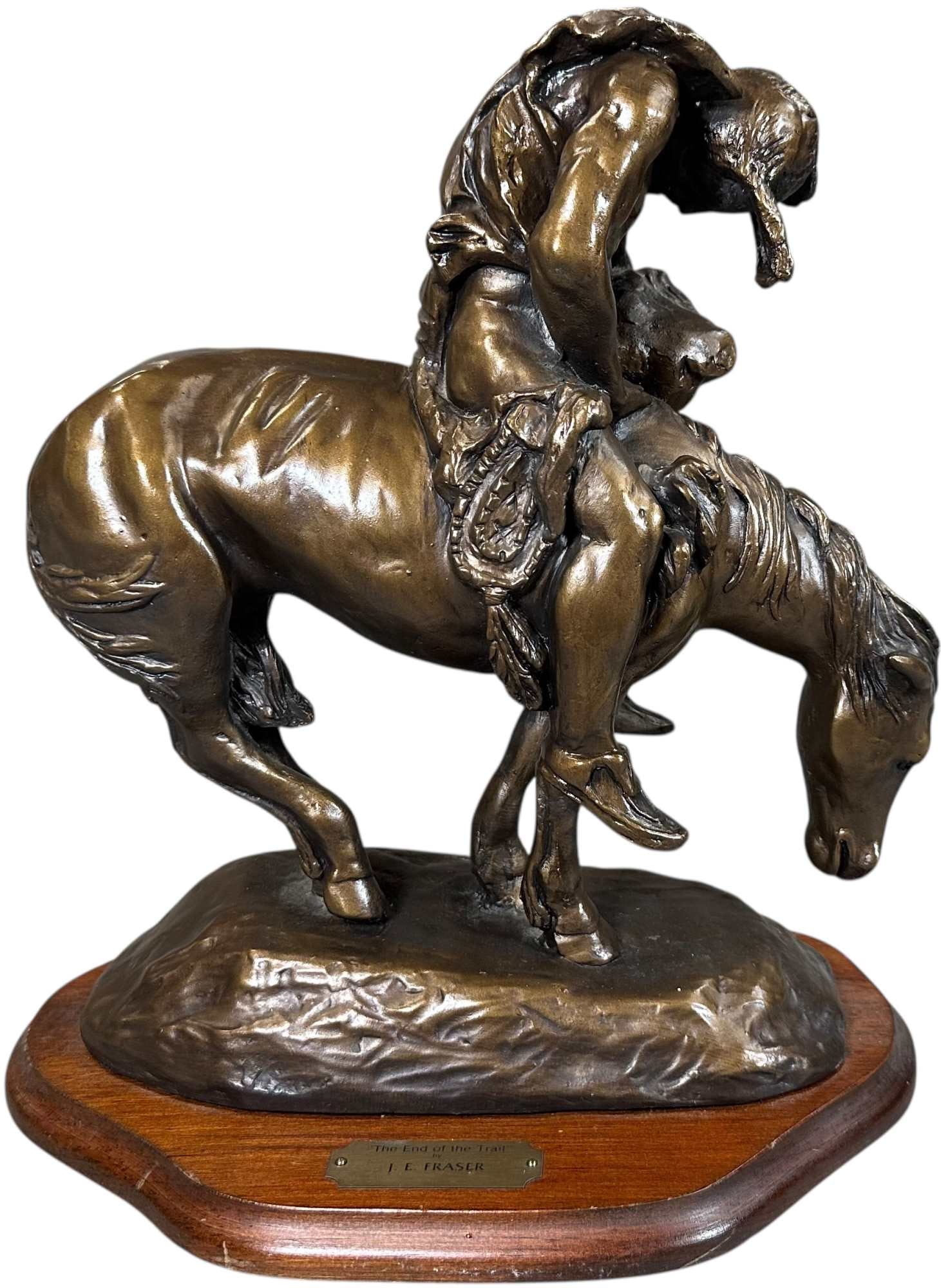 JE FRASER END OF THE TRAIL BRONZE SCULPTURE: 439. JE FRASER END OF THE TRAIL BRONZE SCULPTURE | Patinated bronze sculpture after James Earle Fraser's iconic "The End of the Trail," depicting a weary Native American slumped over his exhausted hor
