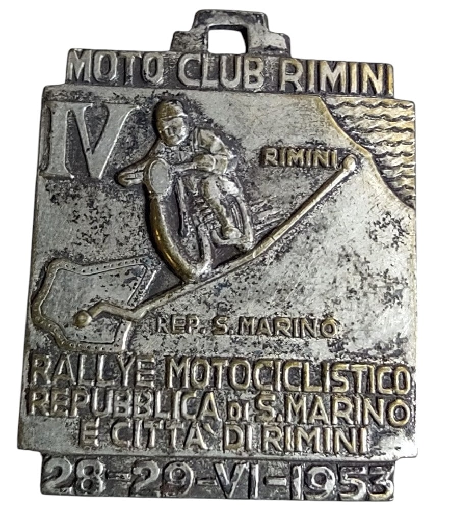 1953 ITALIAN MOTORCYCLE CLUB AWARD: 447. 1953 ITALIAN MOTORCYCLE CLUB AWARD | Stamped translation "Motorcycle Rally Republic of San Marino City of Rimini 28-29-June-1953". From the Italian collection of Steno Tonelli. | 1.5" l. |