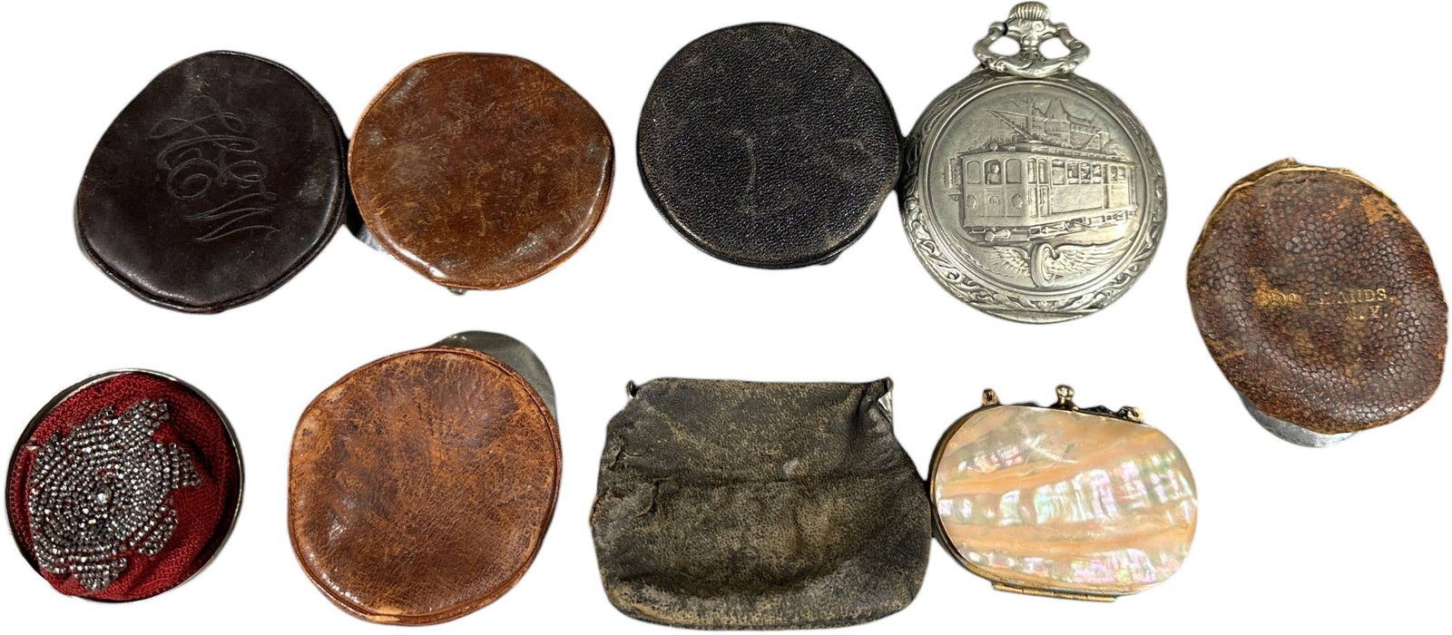EIGHT EARLY AUTOMOBILIA CHANGE PURSES (1 of 6)